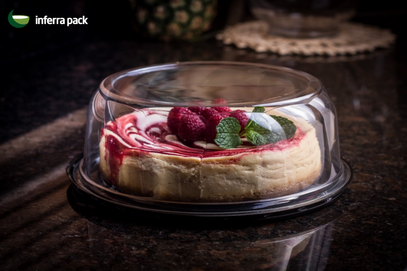 Round cake dome and container for tart with black base.